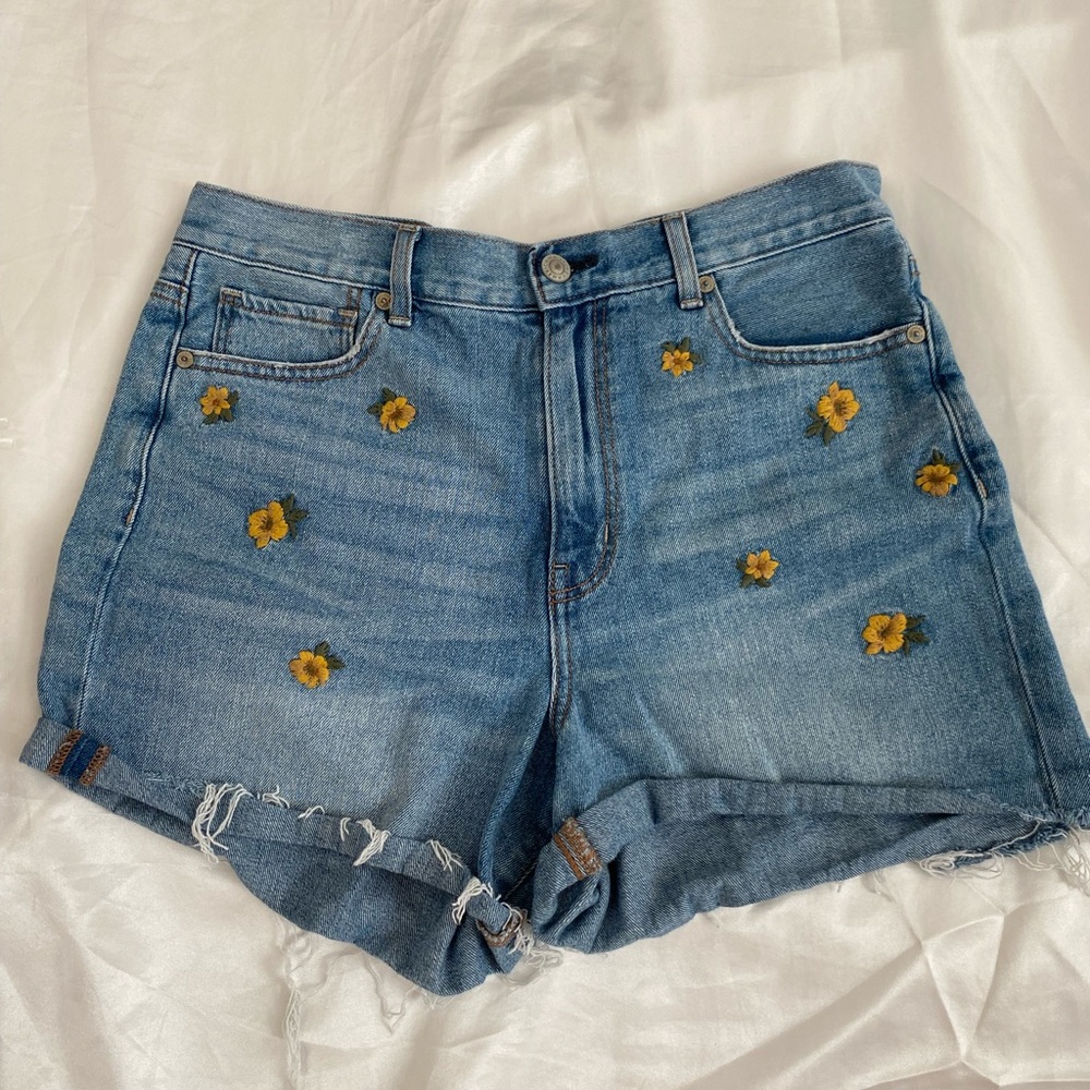 Sunflower embroidered American eagle shorts.